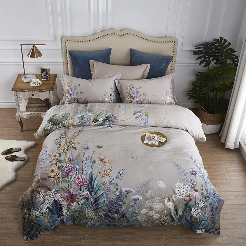Floral bedding set on a bed in a bedroom with a side table and plant.