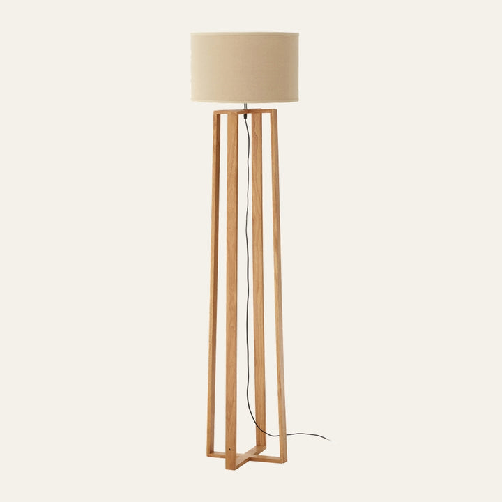 Aelia Wooden Floor Lamp with light oak open-frame tall wooden base, beige fabric drum shade and visible black cord
