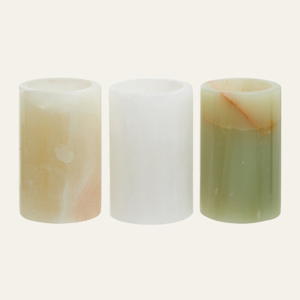 Aevella Onyx Tealight Holder Set: three cylindrical onyx tealight holders in cream, white, and green marbled stone finish