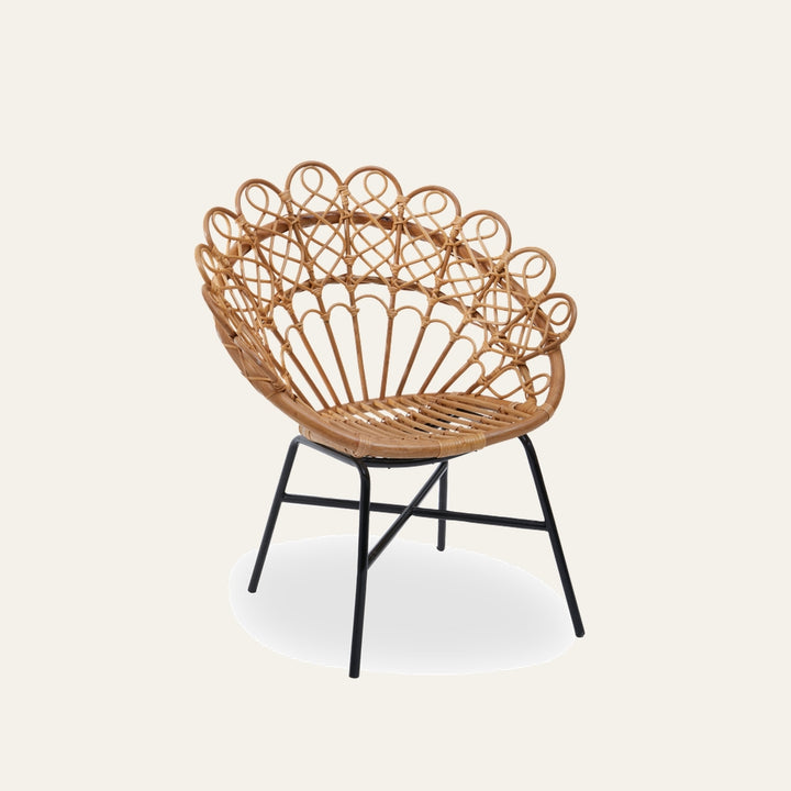 Amavaya Rattan Peacock Chair with natural woven rattan peacock-style back and looped detailing, slatted rattan seat and black metal legs