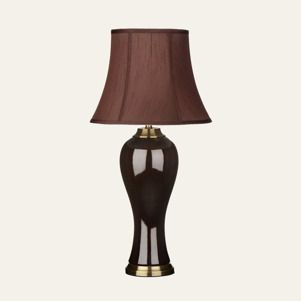 Amavella Brown Shade Feature Lamp with brown bell fabric shade and glossy dark brown curved base with brass accents