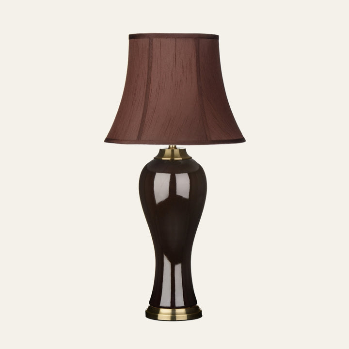 Amavella Brown Shade Feature Lamp with brown bell fabric shade and glossy dark brown curved base with brass accents