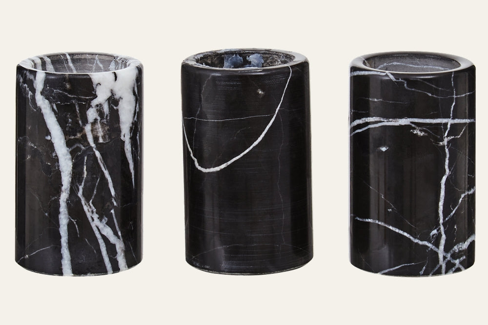 Anoria Tealight Holder Set, three polished black marble cylindrical tealight holders with distinct white veining