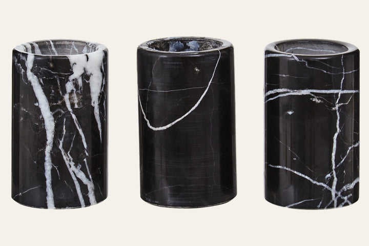 Anoria Tealight Holder Set, three polished black marble cylindrical tealight holders with distinct white veining