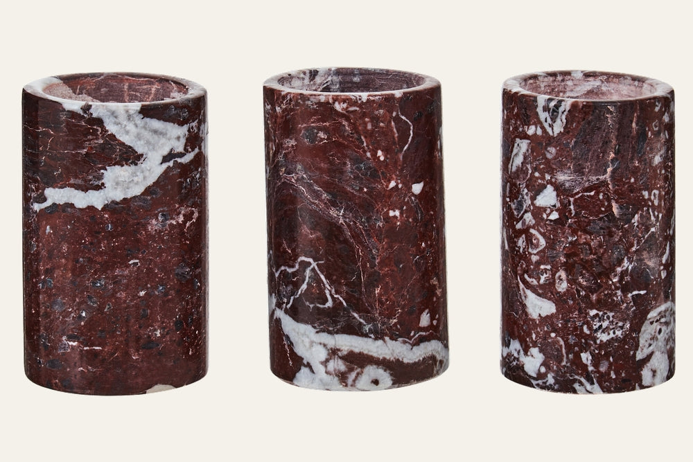 Anoria Tealight Holder Set: three cylindrical dark red marble tealight holders with white veining and polished finish