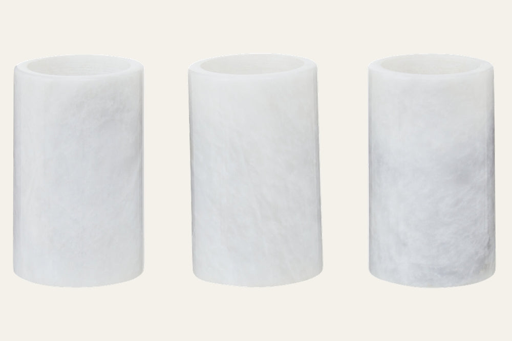 Anoria Tealight Holder Set: three white cylindrical tealight holders with a translucent, stone-like frosted finish