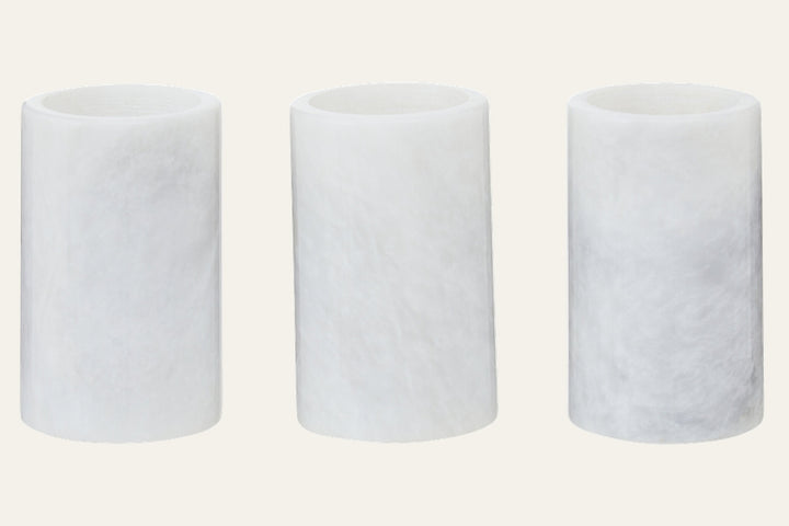 Anoria Tealight Holder Set: three white cylindrical tealight holders with a translucent, stone-like frosted finish