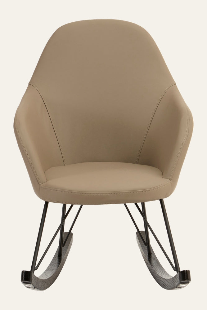 Arariya Open Frame Rocking Chair — tan upholstered curved high-back seat with integrated armrests on a black metal open frame and dark wood rockers