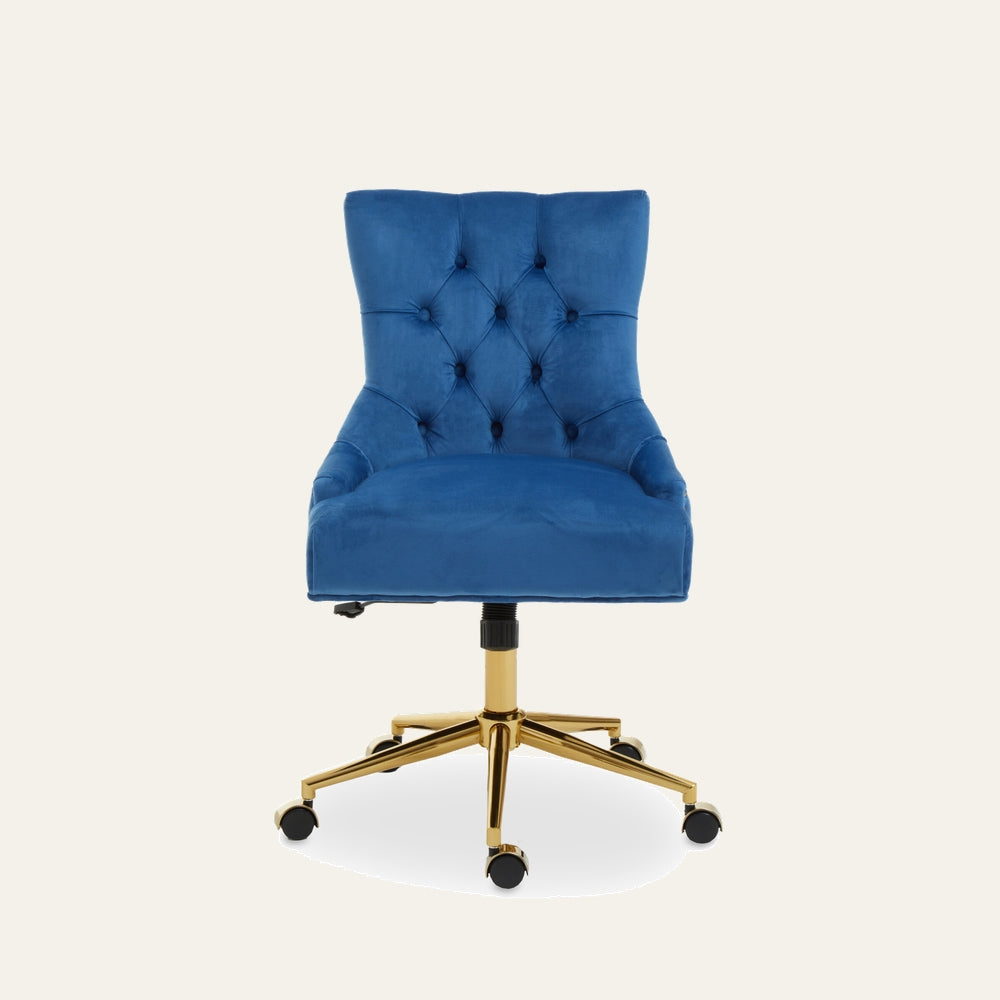Arkor Velvet Desk Chair in royal blue velvet with tufted button back, padded seat and curved sides on a gold metal swivel base with caster wheels