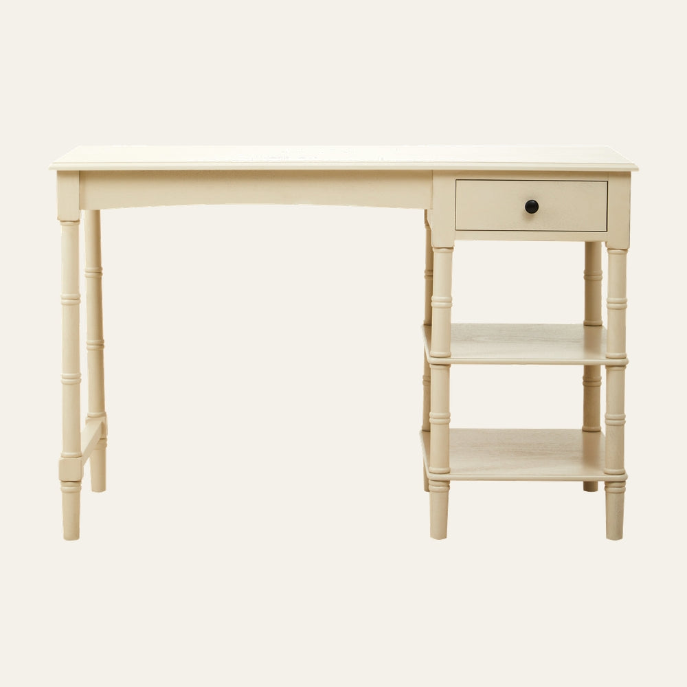Arlen Storage Wood Desk, cream painted wood with turned legs, single right-side drawer with black knob and two open shelves