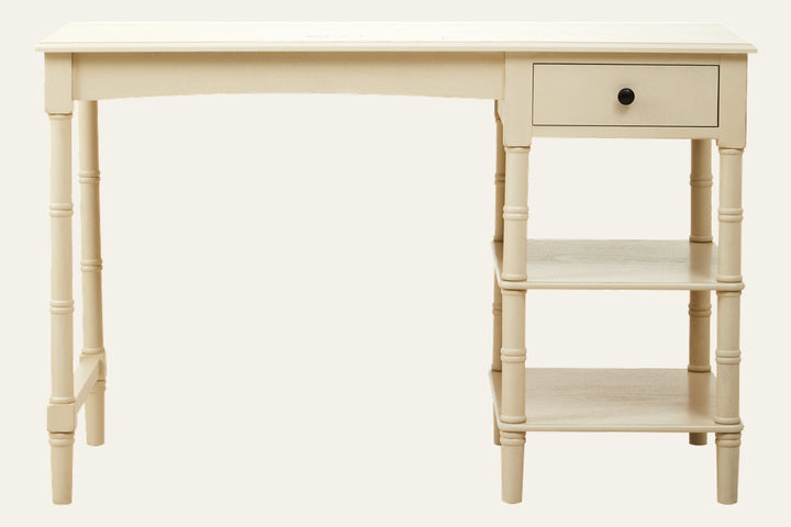 Arlen Storage Wood Desk in cream painted wood with turned legs, one right-side drawer with black knob and two open shelves