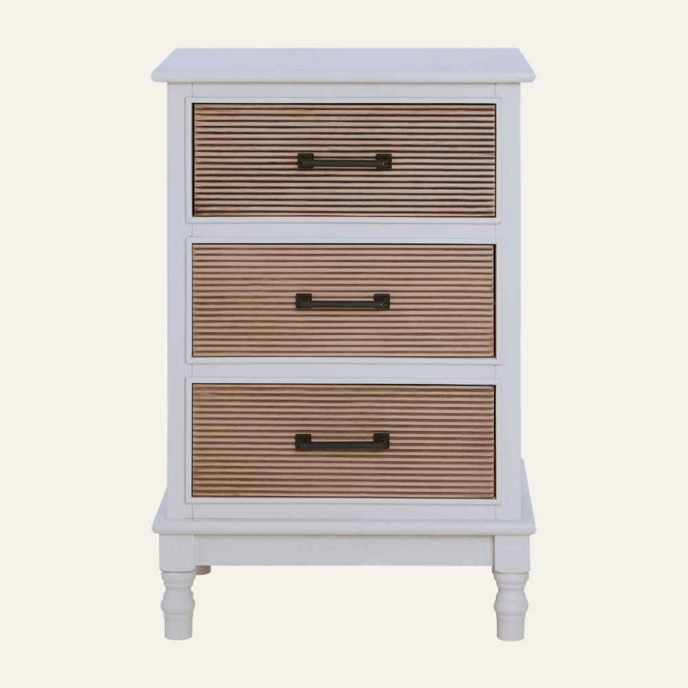 Arlen White Wood Chest of Drawers with three ribbed natural wood drawer fronts, white painted frame, dark metal bar handles and turned legs