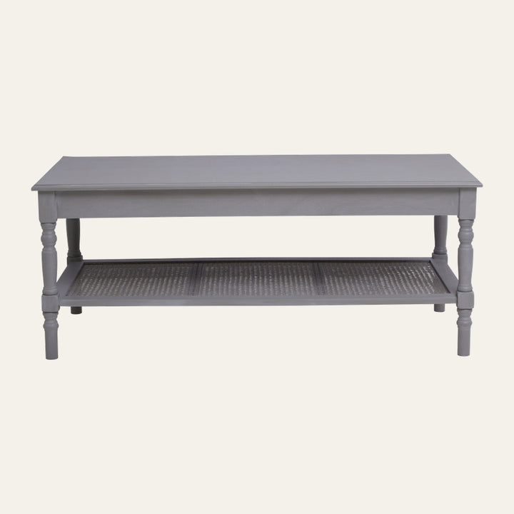 Arlen Wood Coffee Table with rectangular gray painted wood top, turned legs and woven cane lower shelf