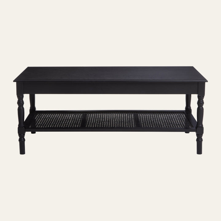 Arlen Wood Coffee Table with rectangular wood top, turned legs in black finish, and a woven lower shelf