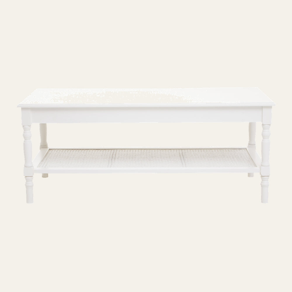 Arlen Wood Coffee Table with rectangular white painted wood top, turned legs, and a lower woven cane shelf