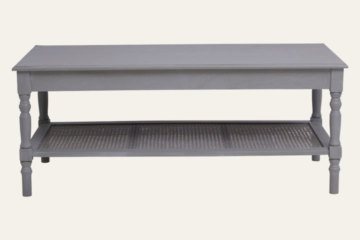Arlen Wood Coffee Table, rectangular grey painted wood top with turned legs and woven cane lower shelf