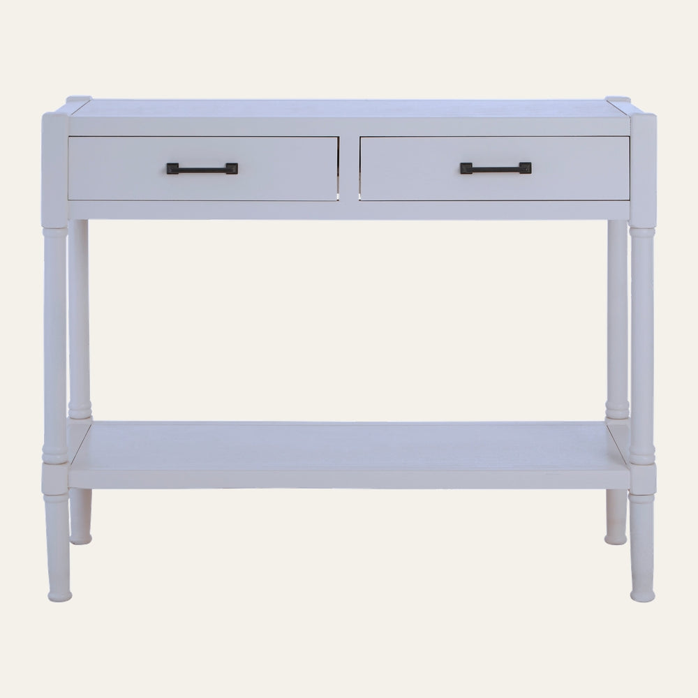 Arlen Wood Console Table in white painted wood with two drawers, black rectangular handles, turned legs and a lower shelf