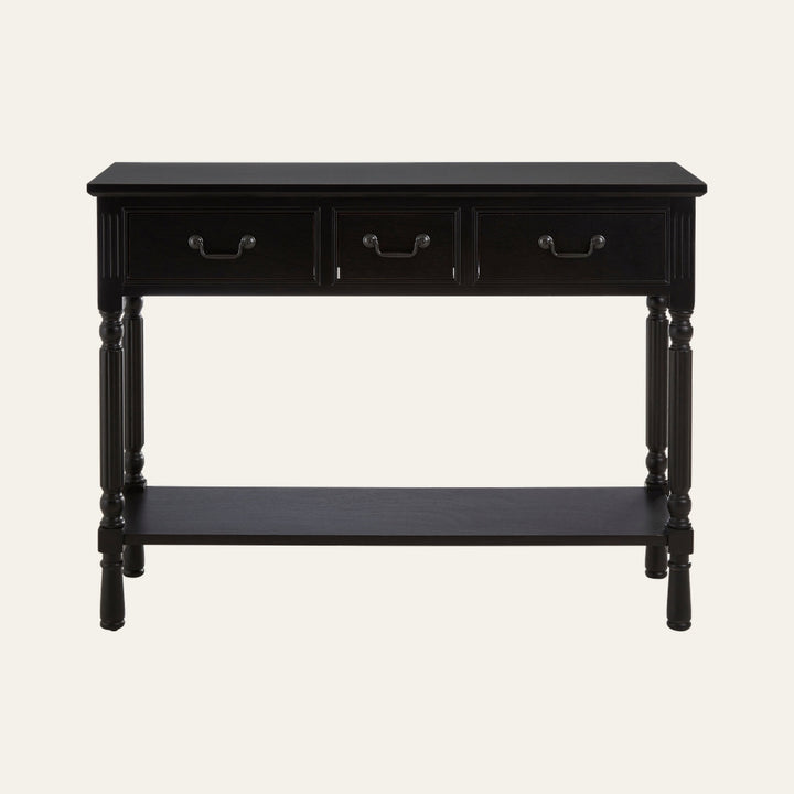 Arlen Wood Console Table in black wood finish with rectangular top, three front drawers with metal handles, turned legs and lower shelf