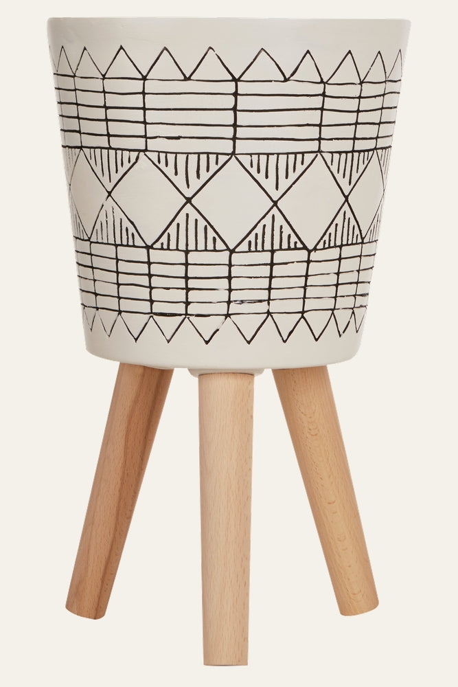Arric Black White Planter — white planter with black hand-drawn geometric pattern on three light natural wood legs