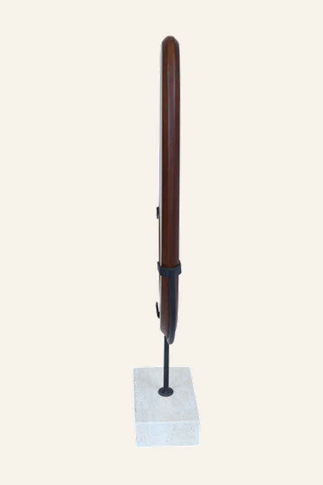 Arsen Wood Vertical Sculpture — slim polished dark brown wood column with rounded top mounted on a black metal rod and square light stone base, held by black bands.