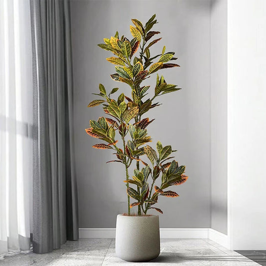 Artificial plant in a pot on a gray floor with a neutral background