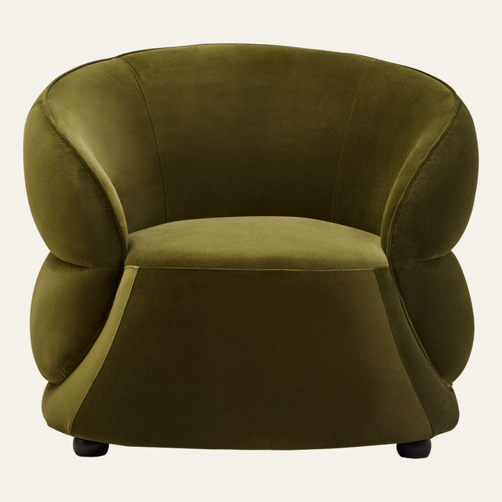 Avaya Velvet Chair in olive green velvet, rounded low-profile barrel silhouette with plush curved arms and a deep seat, supported by short black feet