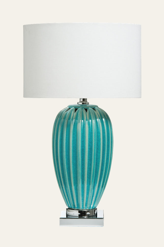 Avia Ceramic Table Lamp with ribbed turquoise glazed ceramic urn-shaped base, chrome square pedestal, and white drum shade