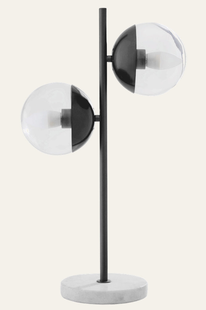 Brric Marble Table Lamp with black metal vertical stem, two half-black/half-clear glass globe shades, and round white marble base.