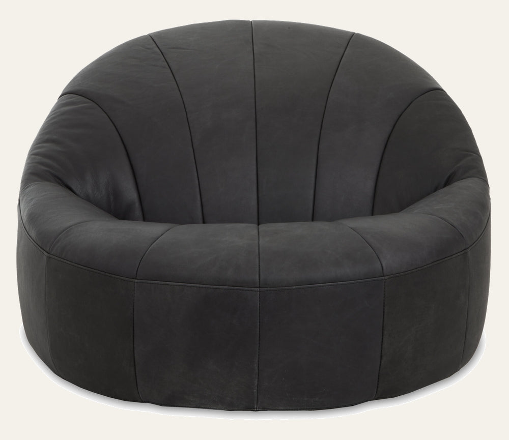 Caelver Accent Chair, round low-profile bucket chair in dark charcoal leather with vertical stitched panels and plush padded seat and arms.
