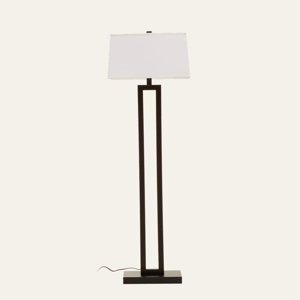 Celdora Floor Lamp with tall rectangular open-frame in matte black finish, flat rectangular base, white rectangular fabric shade and visible power cord