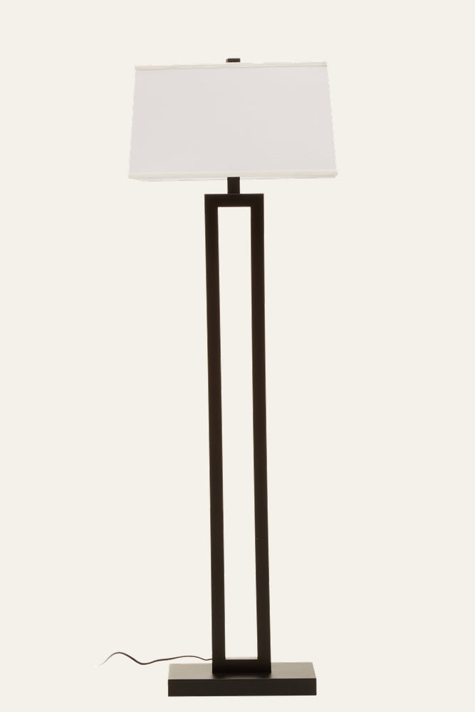 Celdora Floor Lamp with open rectangular black metal frame and rectangular base, topped by a white fabric rectangular shade; cord visible at base.