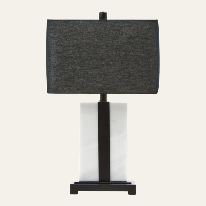 Doran Marble Table Lamp with rectangular dark gray fabric shade above a white rectangular marble column base accented by a central black metal strip and black platform base.