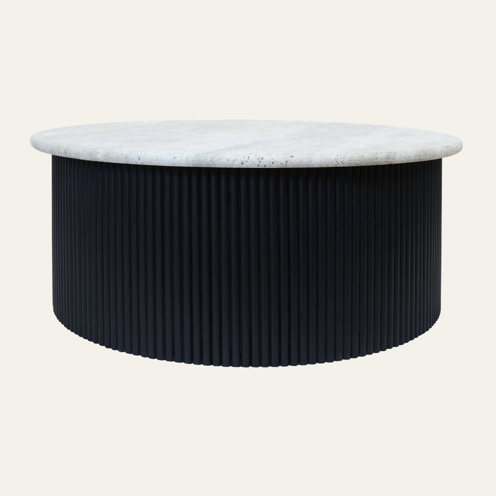 Dorar Travertine Top Coffee Table with round pale travertine stone top and cylindrical black fluted base