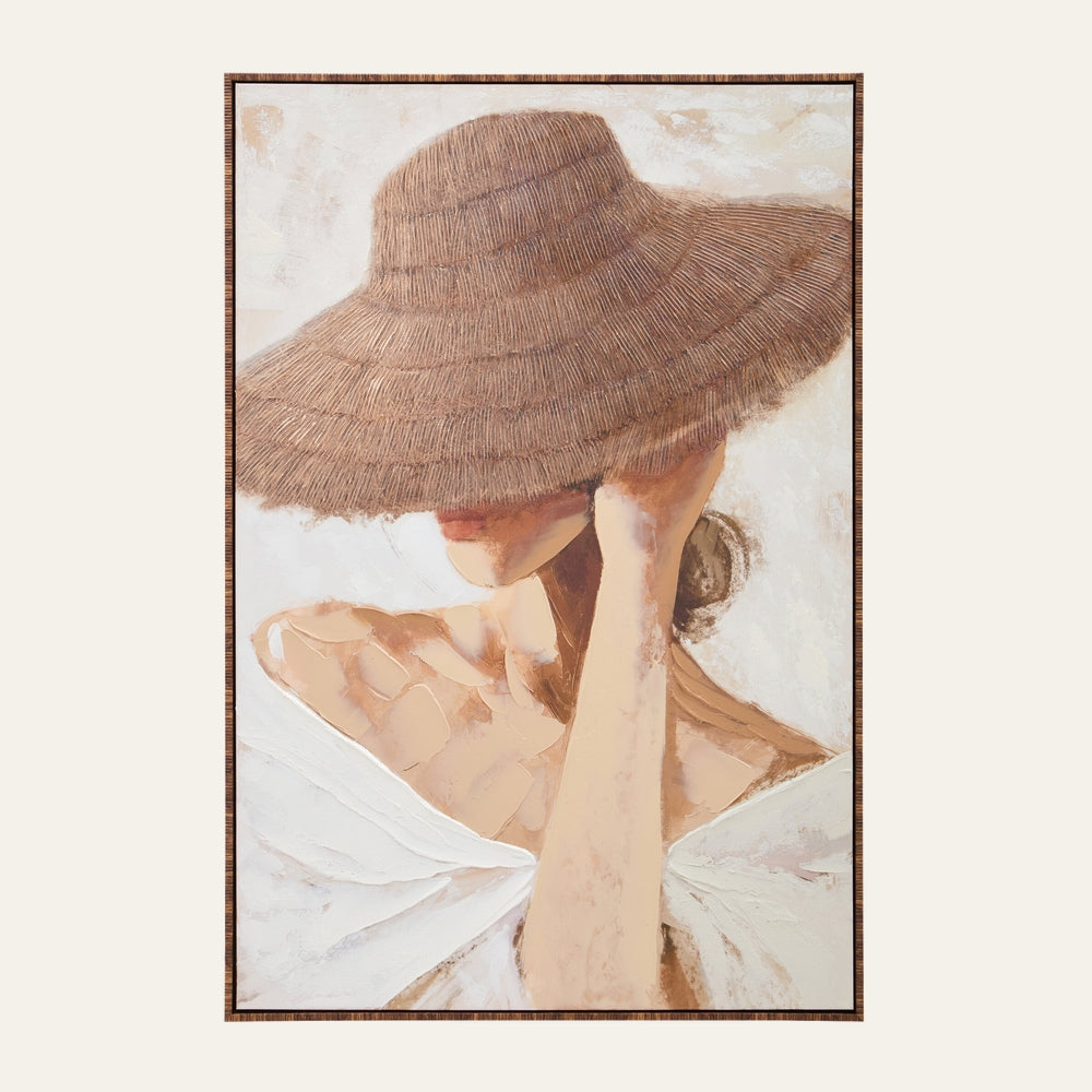 Dorven Wall Art — textured painting of a woman with a wide woven straw hat obscuring her face, off-shoulder white dress, soft neutral beige tones, shown in a thin wood frame.