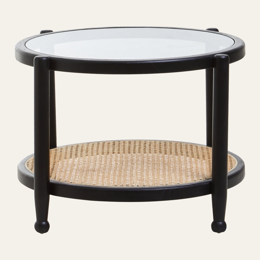 Drevan Rattan Glass Coffee Table — round black wooden frame with clear glass top and natural woven rattan lower shelf