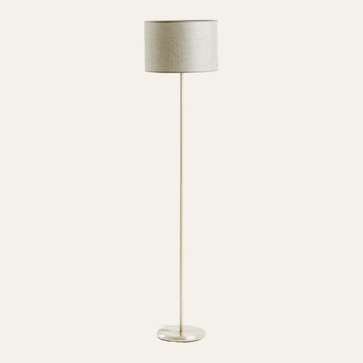 Elara Chrome Floor Lamp with slim chrome pole and round chrome base, topped by a light beige linen drum shade