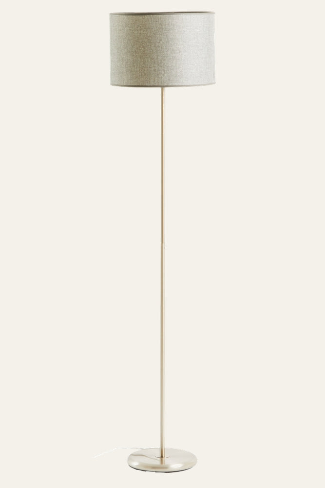 Elara Chrome Floor Lamp with slim chrome pole and round chrome base, topped by a light gray woven fabric drum shade