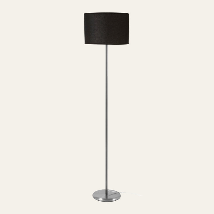 Elara Floor Lamp with black fabric drum shade, slender chrome pole and round chrome base
