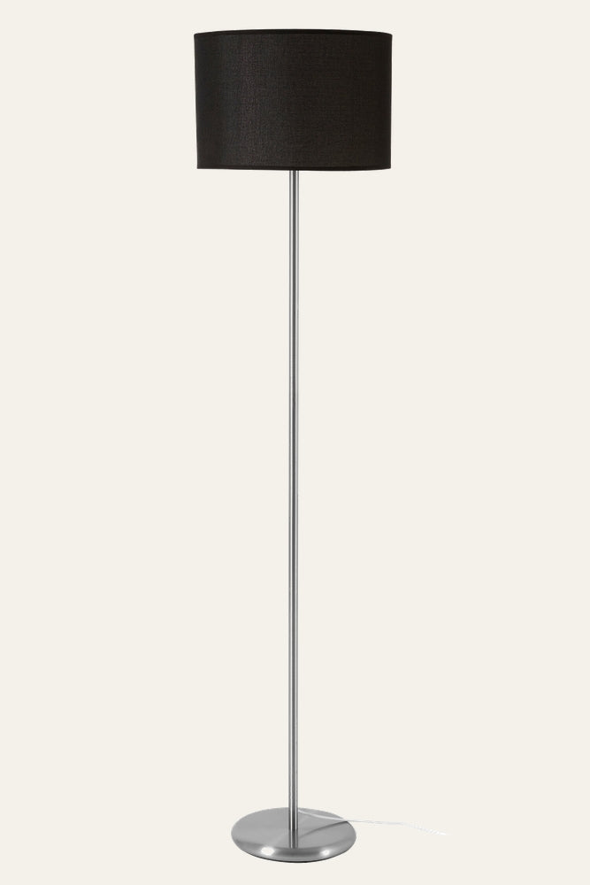 Elara Floor Lamp with slim brushed metal pole and round metal base, topped by a black fabric drum shade