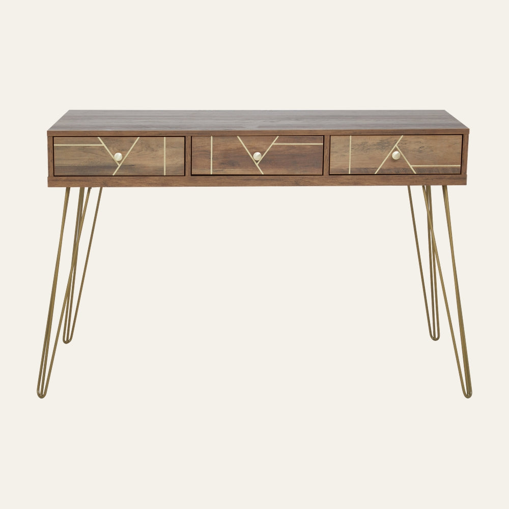 Elian Three Drawer Desk with walnut-tone wood top, three front drawers with gold geometric inlay and round brass knobs, on slender gold hairpin metal legs