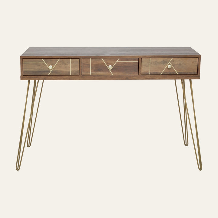 Elian Three Drawer Desk with walnut-tone wood top, three front drawers with gold geometric inlay and round brass knobs, on slender gold hairpin metal legs