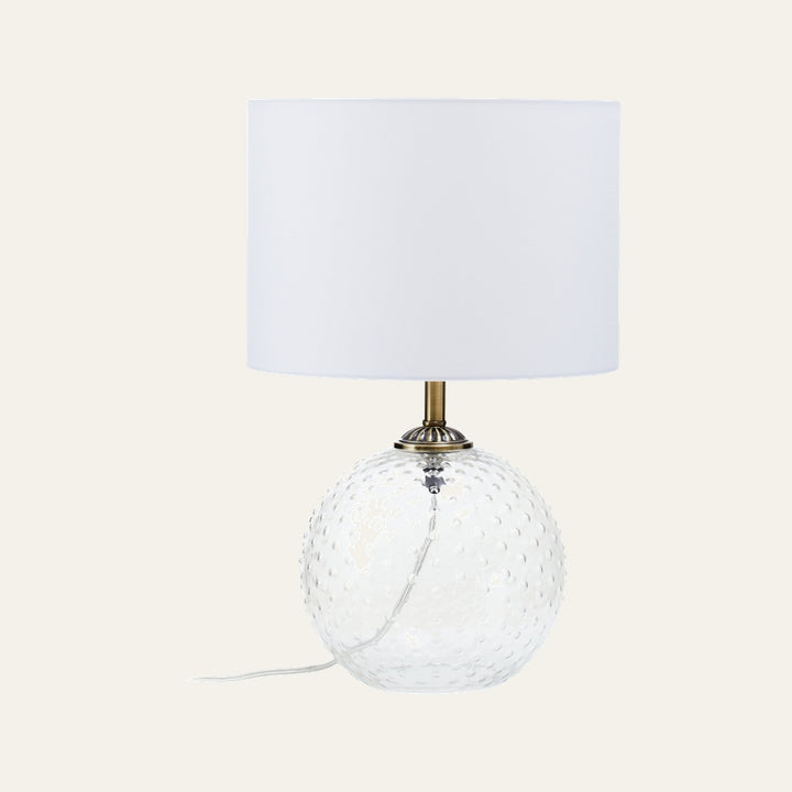Elivella Table Lamp with clear hobnail glass globe base, antique brass neck, and white fabric drum shade