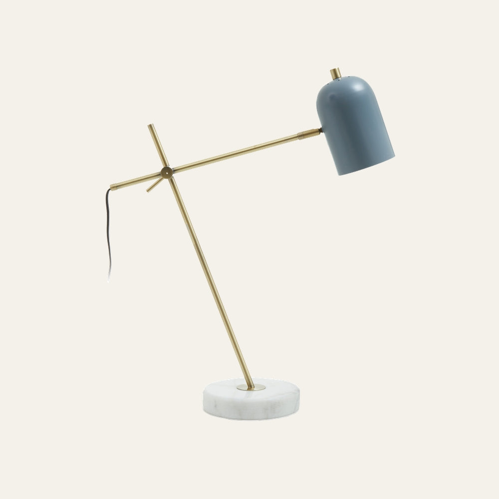 Elran Marble Desk Lamp with round white marble base, angled brass metal arms and pivot, and a matte blue dome shade with a visible black cord.