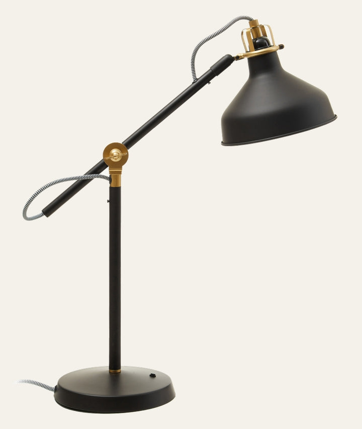 Elran Metal Desk Lamp with adjustable black metal arm and conical shade, brass accents, round base, and black-and-white braided cord
