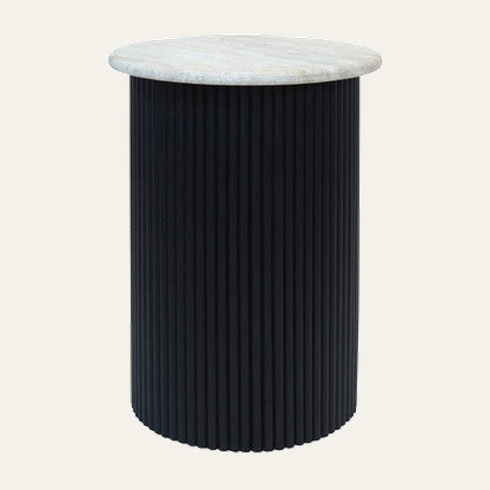 Elsen Travertine Side Table with round light travertine top and tall black fluted cylindrical base