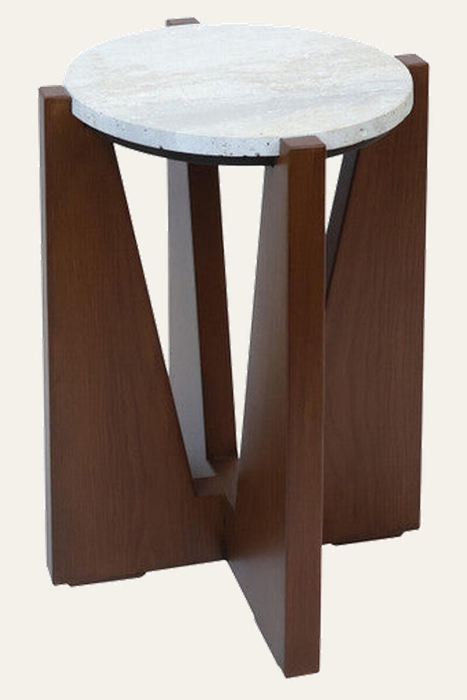 Elsen Travertine Side Table with round light travertine stone top on a brown wood geometric V-shaped base