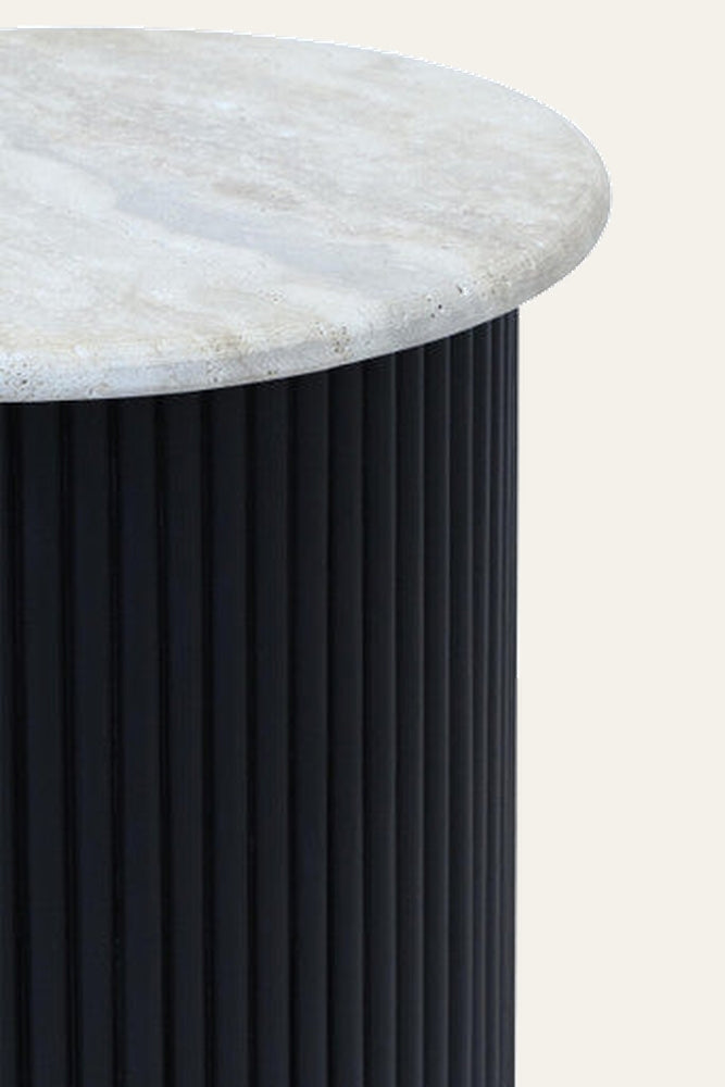 Elsen Travertine Side Table with round pale travertine top and tall black fluted cylindrical base