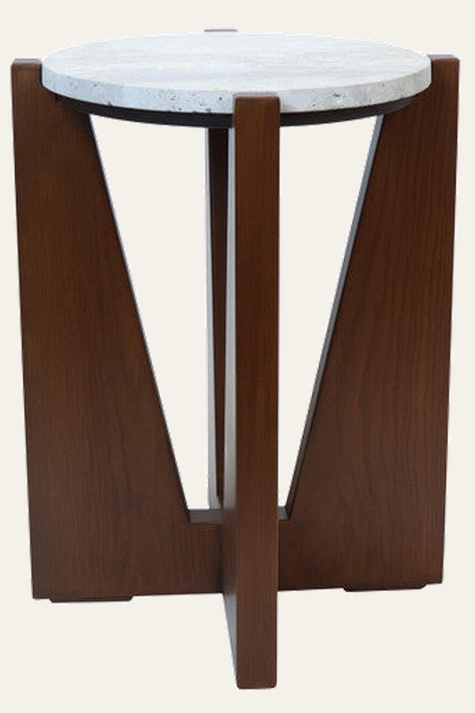 Elsen Travertine Side Table with round light travertine top and dark brown three-panel wooden base featuring V-shaped openings