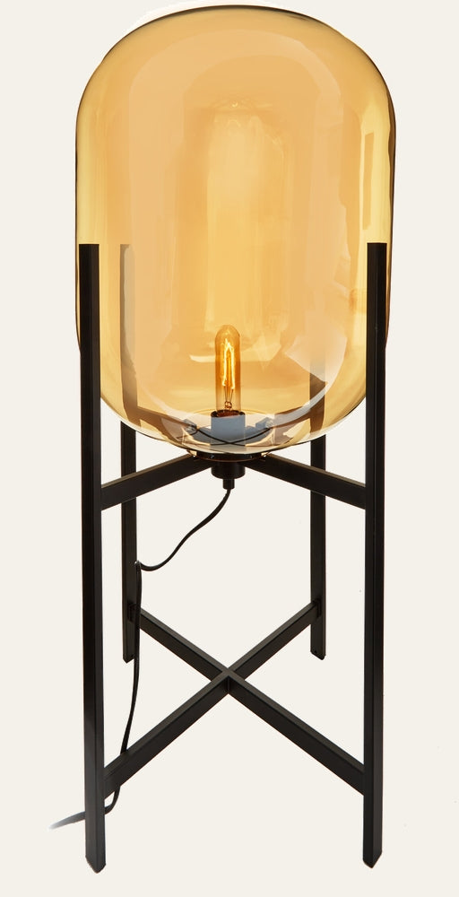 Erathia Glass Floor Lamp with large amber glass dome shade, exposed filament bulb, and black metal tripod base with X-cross supports