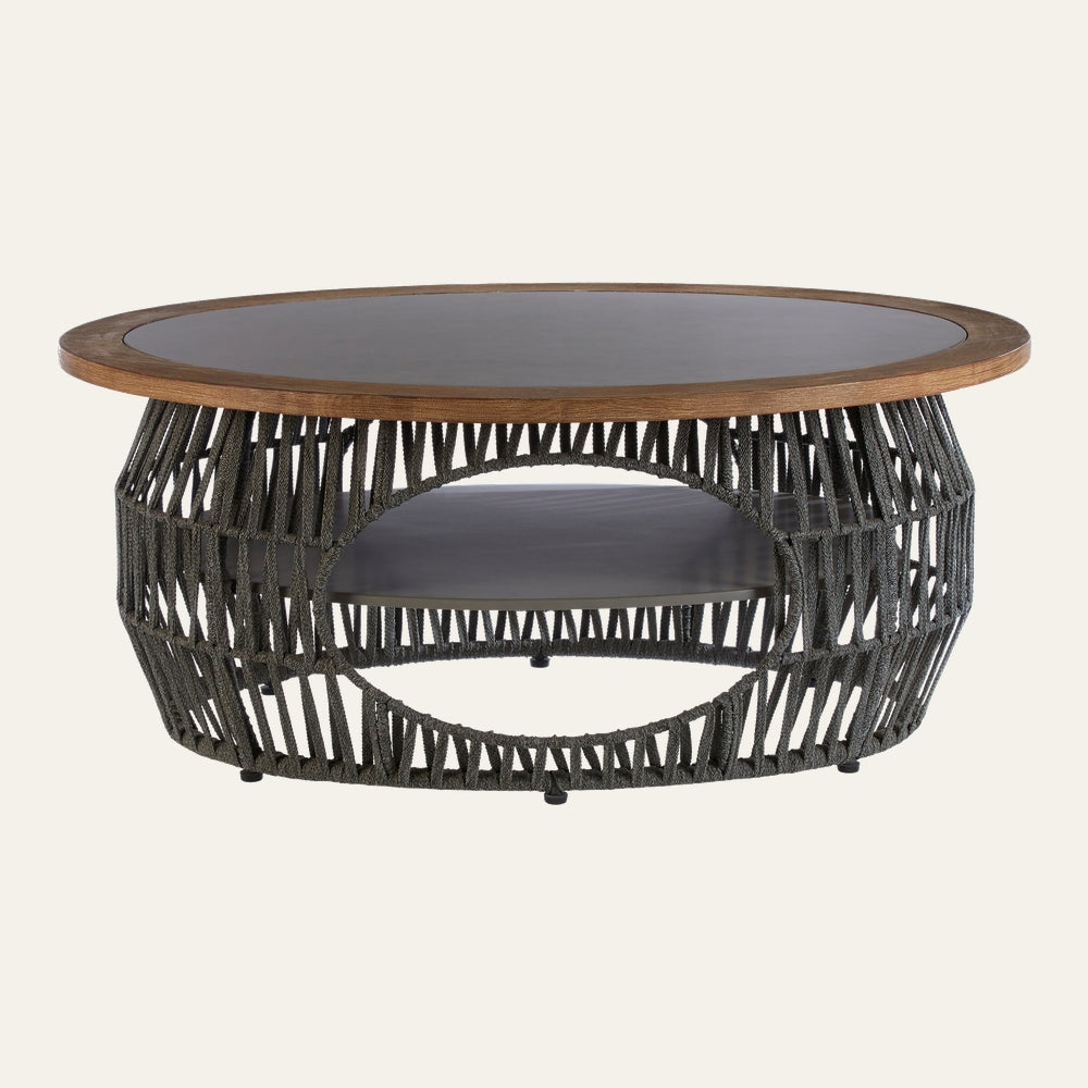 Eravaya Woven Rope Coffee Table with round wood-rim top and dark inset, open woven charcoal rope base with circular cutout and lower shelf